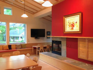 interior view of common house with vaulted ceiling and fireplace